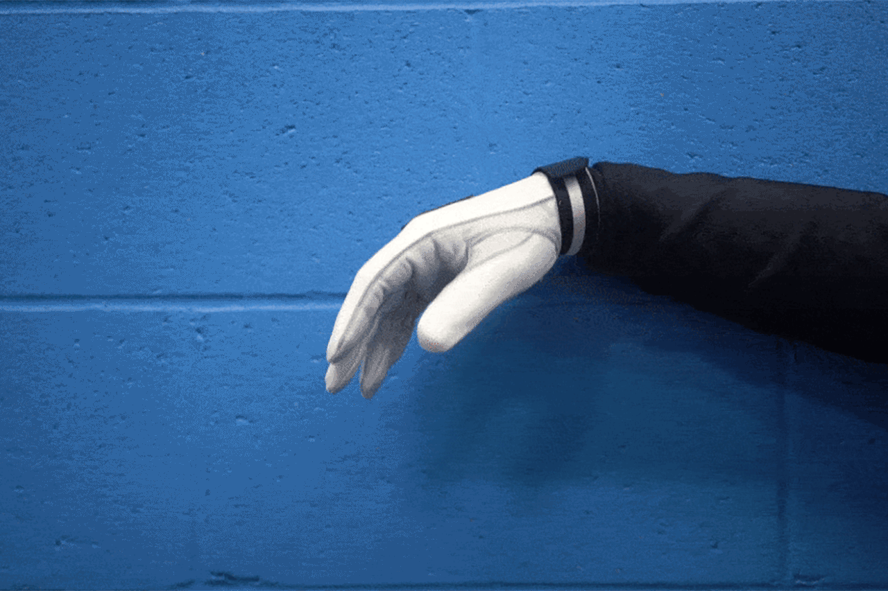 gloved white hand giving the relax hand signal