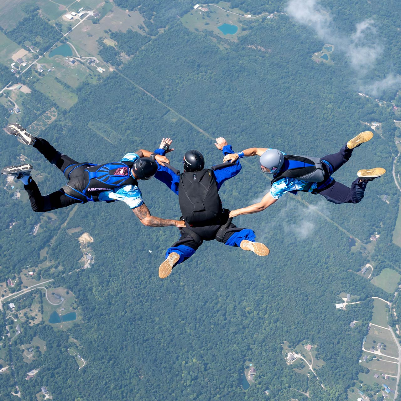 Accelerated Freefall Student with an AFF Instructor on either side to maintain stability in freefall