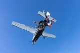 Tandem jumpers in freefall just following exiting the airplane.