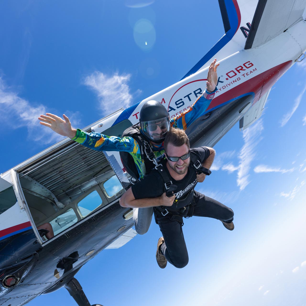 Tandem instructor and student exiting from an aircraft